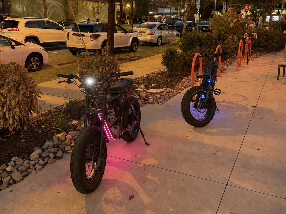 Both Super73 bikes with custom LED lighting at night